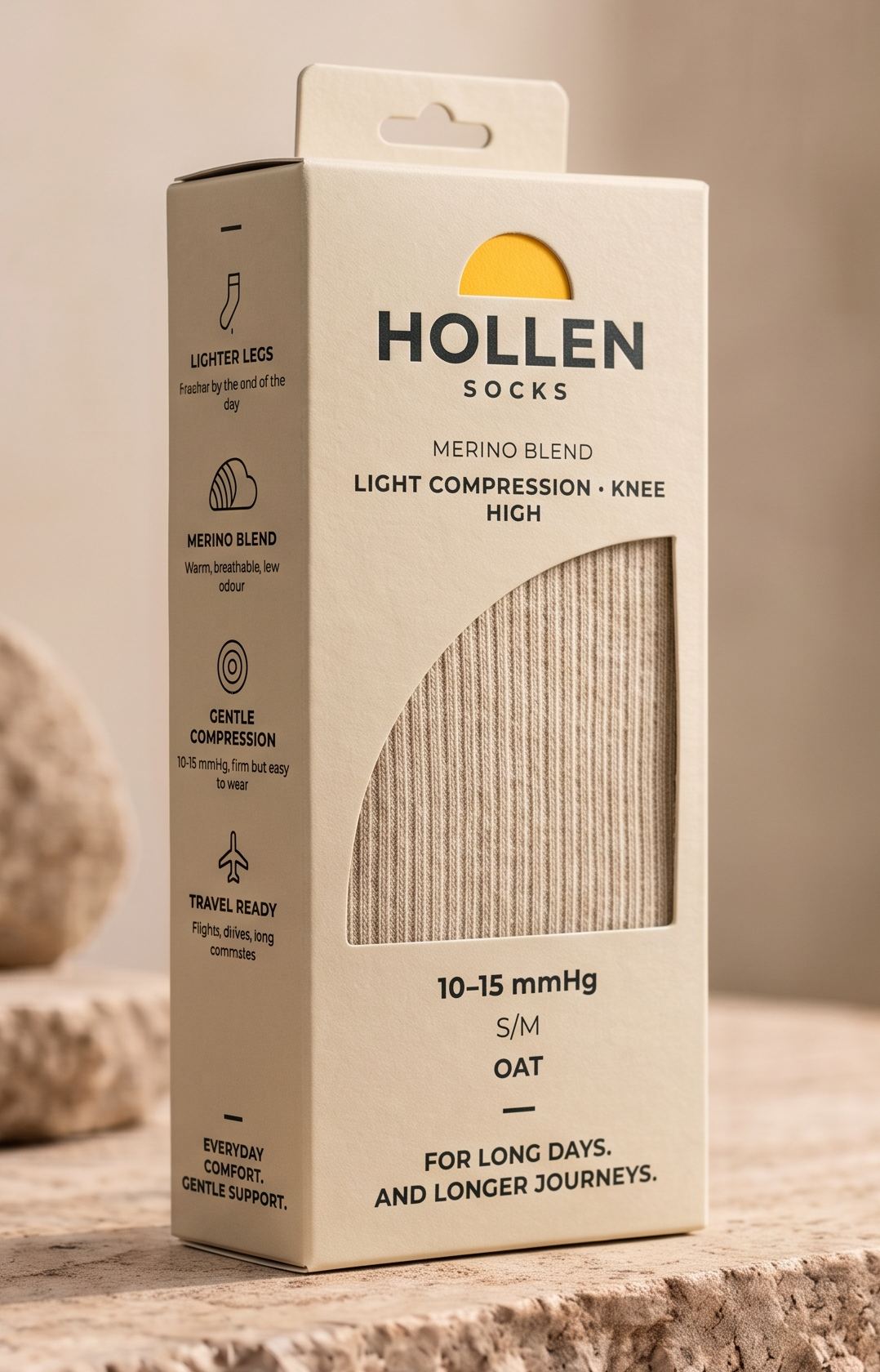 Oat Hollen sock box with a yellow half-circle above the Hollen wordmark and a window showing the ribbed knit